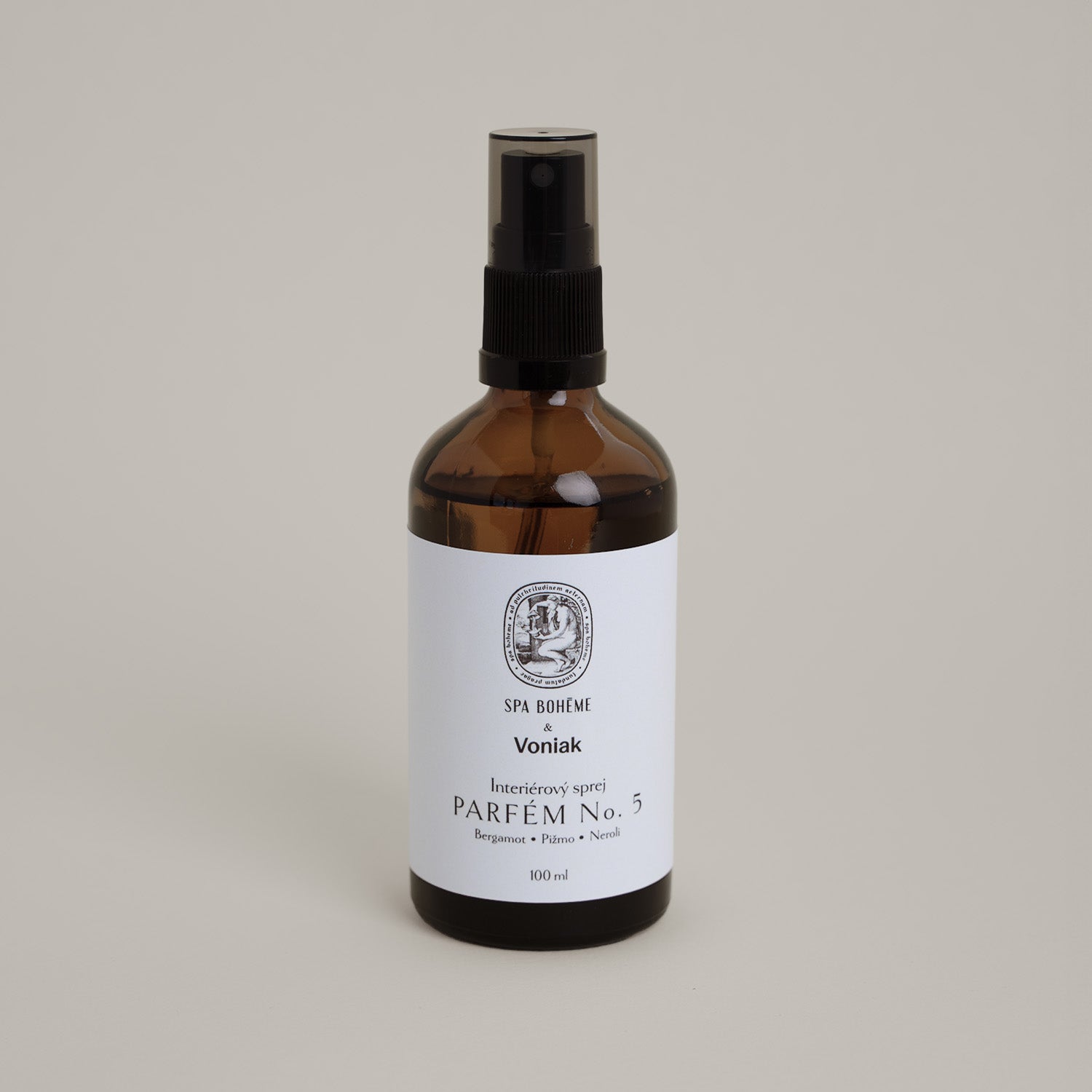 a bottle of liquid parfume with a white label